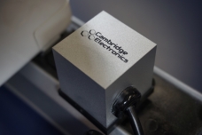 Shown here is a prototype laptop power adapter made by Cambridge Electronics using GaN transistors. At 1.5 cubic inches in volume, this is the smallest laptop power adapter ever made.