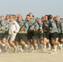 U.S. Army soldiers take part in a morning run at Camp New York, Kuwait, in 2002.