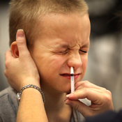 An elementary school student Shane Shorter gets a a dose of FluMist in Gainesville, Fla.